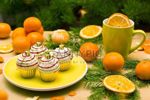 Christmas decorations, tangerines and fir branches - image #182615 gratis