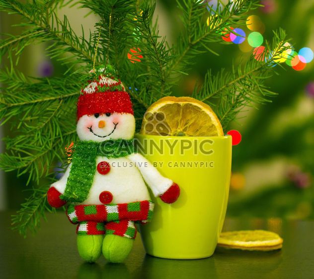 Christmas snowman, cup of tea and fir branch - Free image #182625