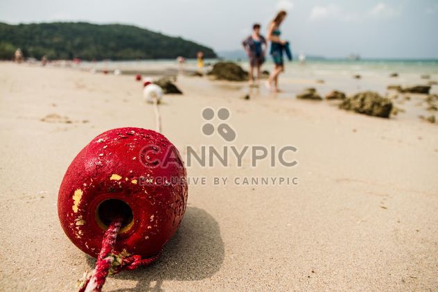 Red buoy on a sand - image #183435 gratis