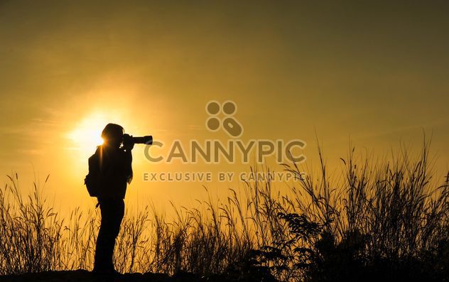 Photographer silhouette at sunset - image #186465 gratis