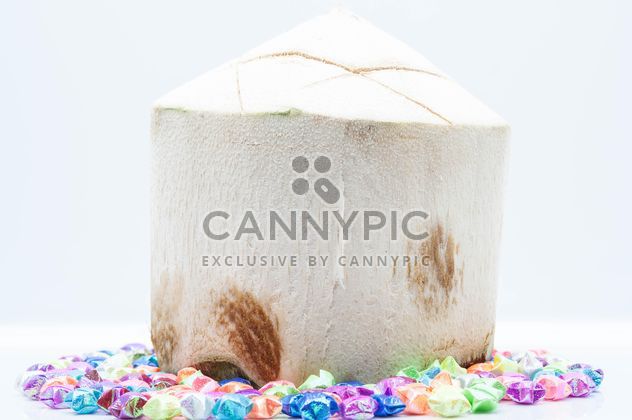 Young coconut and decorations on white background - image gratuit #186565 