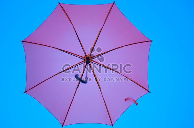 Pink umbrella hanging - image #273085 gratis