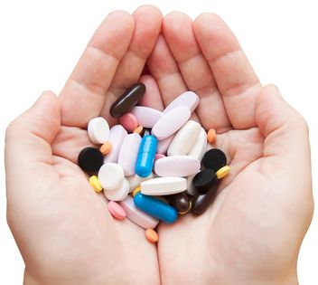 Colored pills in hands - Free image #273165