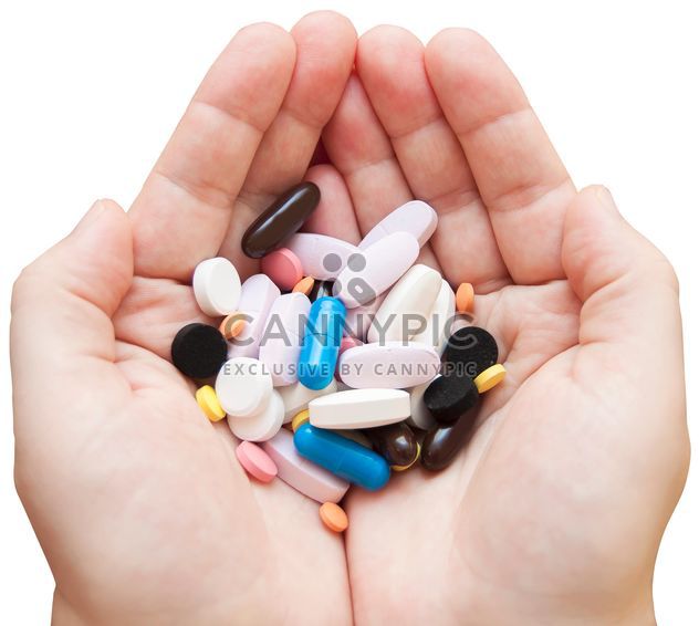 Colored pills in hands - Free image #273165