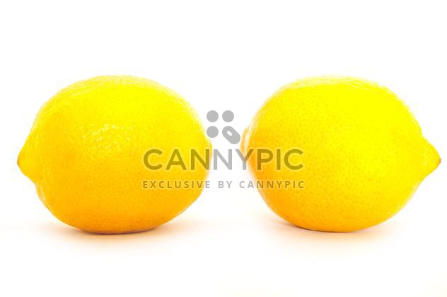 Two lemons isolated on white background - бесплатный image #273185