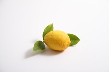 lemon with leaf on white background - image gratuit #302795 