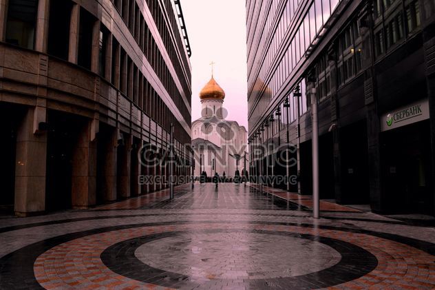 View on church between two buildings - бесплатный image #317385