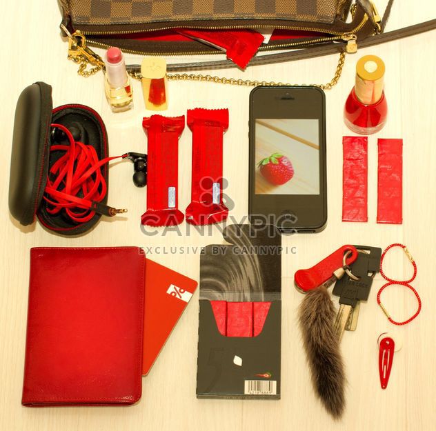 set in red tones: headphones, lipstick, telephone, chocolates, license, passport, map, elastic, barrette - бесплатный image #342475
