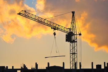 Construction crane at sunset - Free image #346895