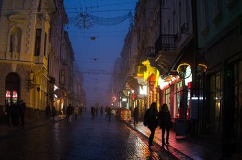 People and architecture on night street - бесплатный image #346945