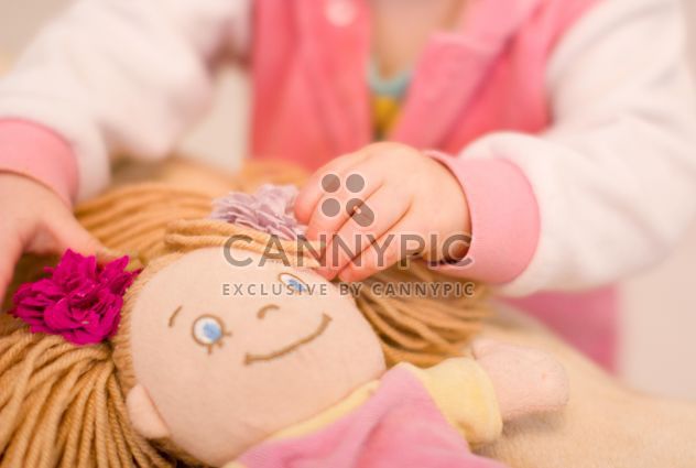 Closeup of baby doll hands of small girl - image #347925 gratis