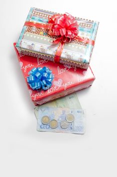 Decorated gift boxes and money on white background - бесплатный image #452545