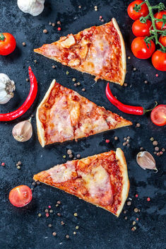 Flat lay composition slices of pizza with bacon, cheese and tomato sauce - Free image #459615