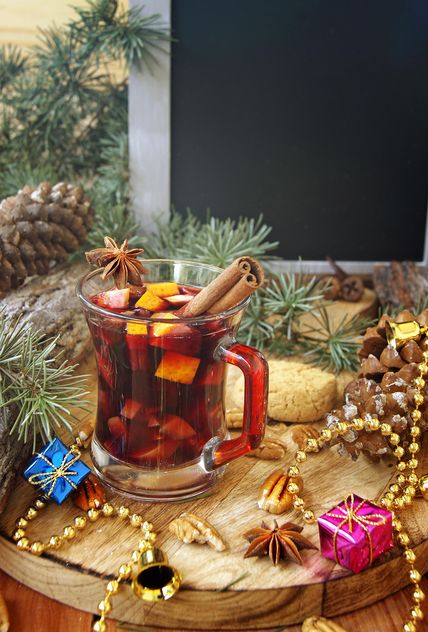 mulled wine in the cup and Christmas decorations - image gratuit #136645 