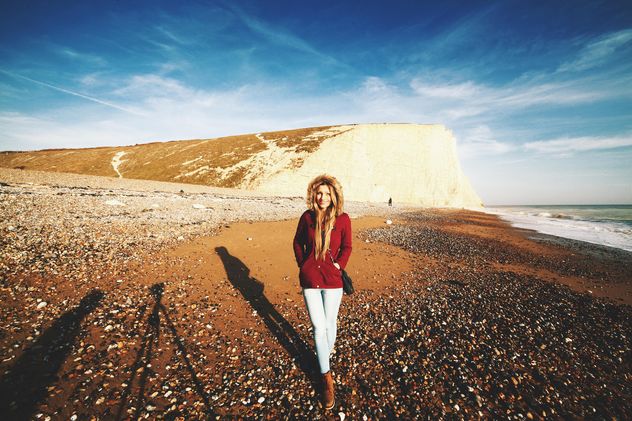 Cute girl in autumn clothes with Beachy Head - Free image #183635