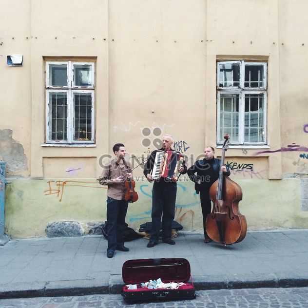 Musicians in the street - image #183715 gratis