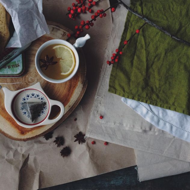 Cup of tea, rowan berries and napkins - image #183825 gratis
