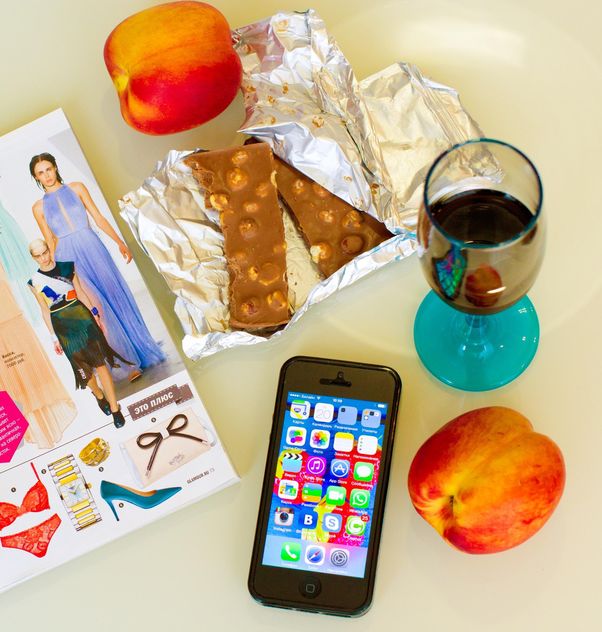 Chocolate, peaches, glass of drink and smartphone - image #186005 gratis