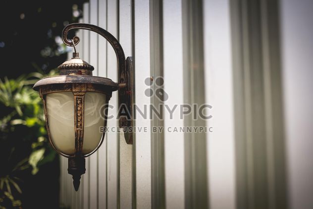 Vintage lantern on wall - бесплатный image #186095