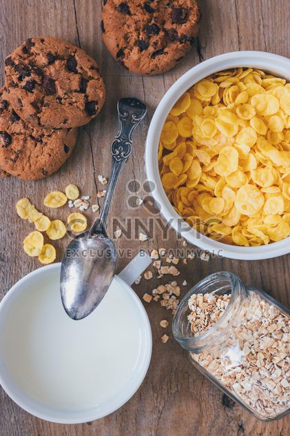 Cereals, milk and cookies for breakfast - image #187895 gratis