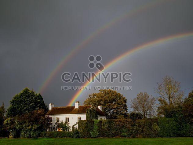Landscape with rainbow over house - бесплатный image #198235