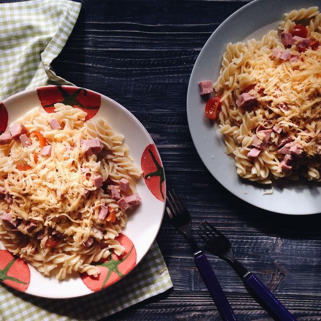 Two portions of pasta with cheese and tomato - Free image #198515