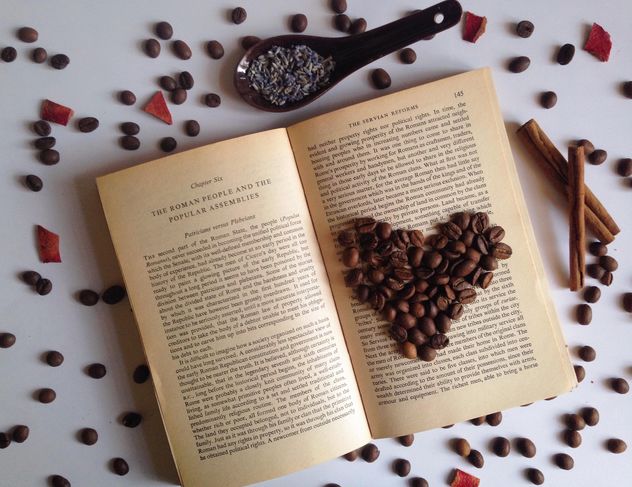 coffee beans on the open book - image #198755 gratis