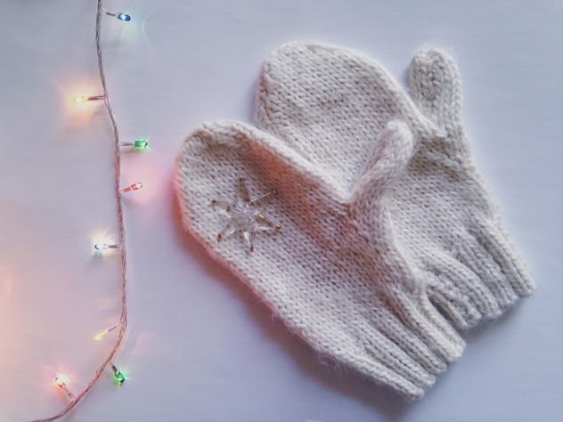 Mittens and garland on white background - Free image #198775