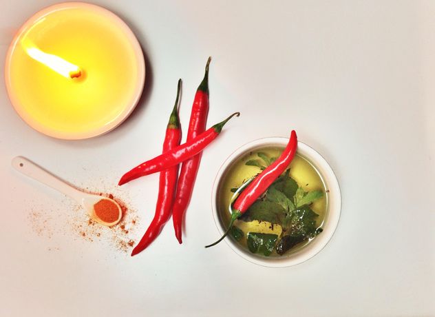 Cup of tea, chili and candle - image #198945 gratis