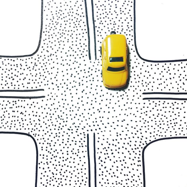 Yellow toy car on a crossroads - бесплатный image #271735