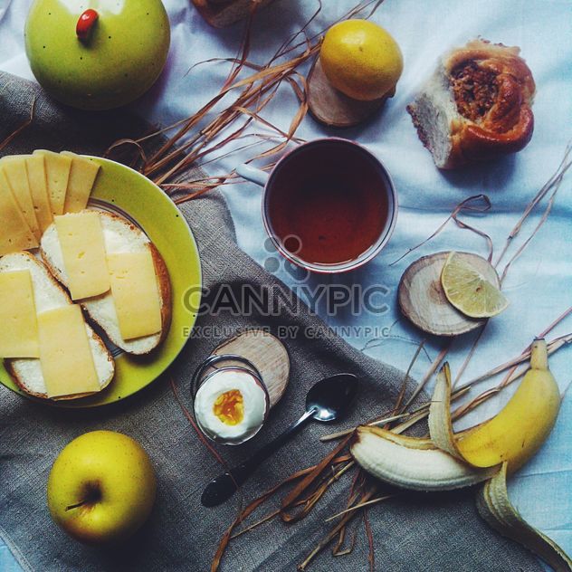 Cheese sandwiches, fruit and cup of tea - бесплатный image #272215