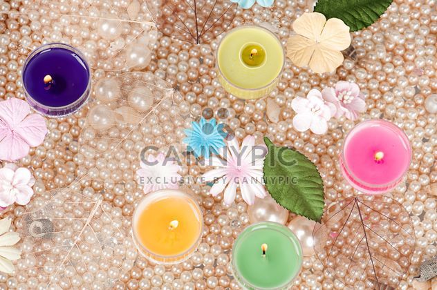 Colored candles, pearls and decorative flowers - бесплатный image #272545