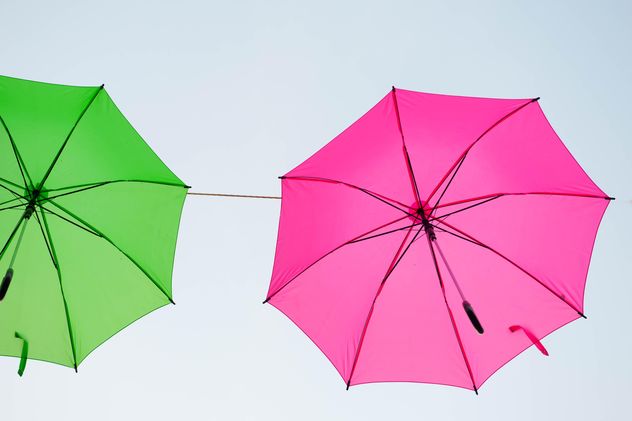 Green and pink umbrellas hanging - image gratuit #273065 