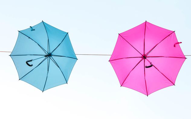 Blue and pink umbrellas hanging - image gratuit #273075 