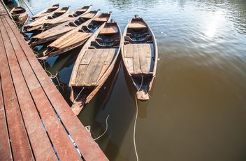 Wooden boats on a pier - бесплатный image #301455