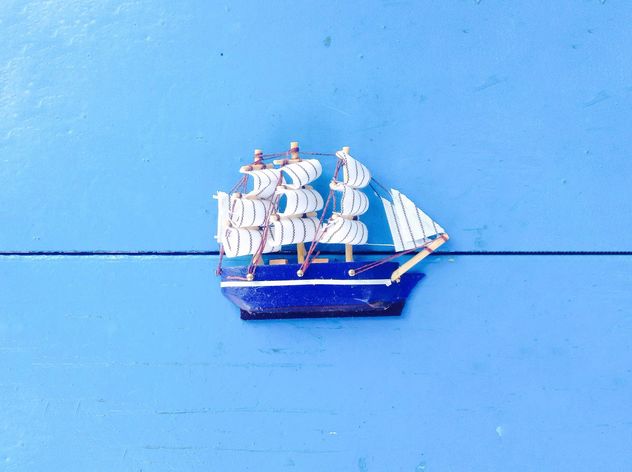 Toy ship on blue background - Free image #328185