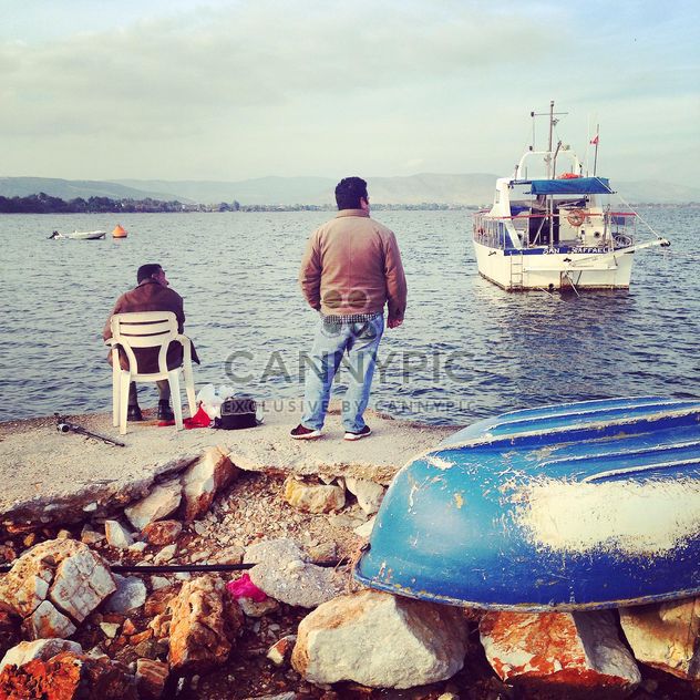 Fishermen on the rocky shore, Greece - Free image #331775