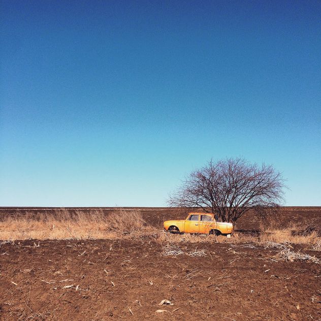 Old yellow car in field - Free image #332135