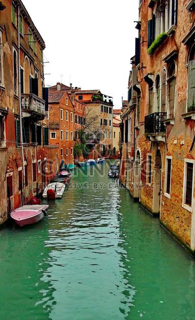 Gondolas on canal in Venice - image #333615 gratis
