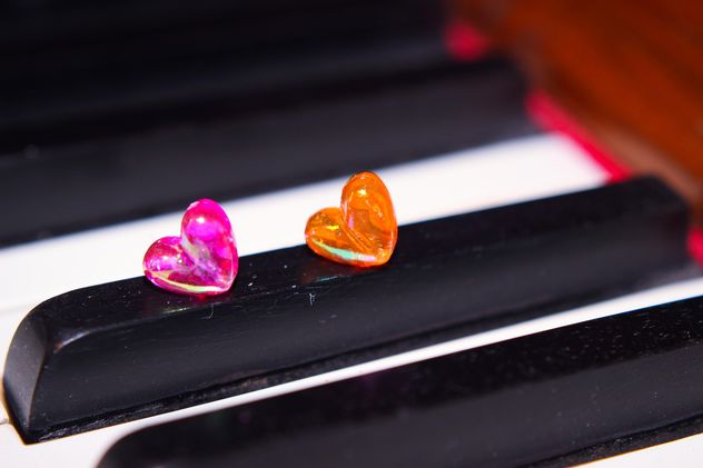 Closeup of piano decorated with tiny hearts - Free image #341475