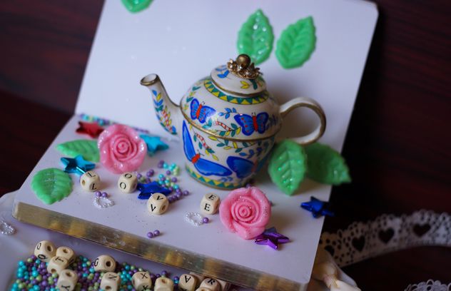 diary, watering can decorated with flowers and ribbons - бесплатный image #342115