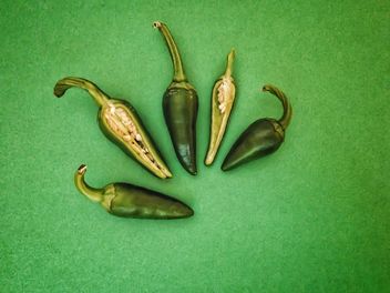 Green peppers on green background - бесплатный image #344525