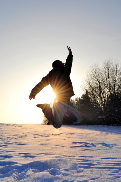 Happy man jumping on snow - Free image #346605