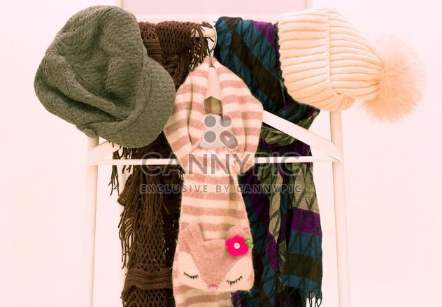 Warm scarves and hats on white background - Free image #347965