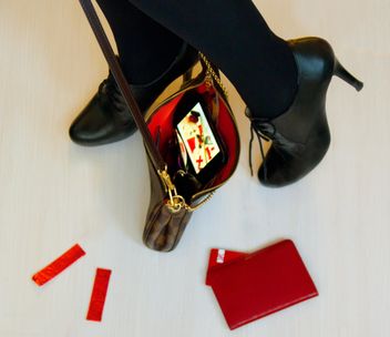 Female feet in high heel shoes with black handbag - Free image #348015
