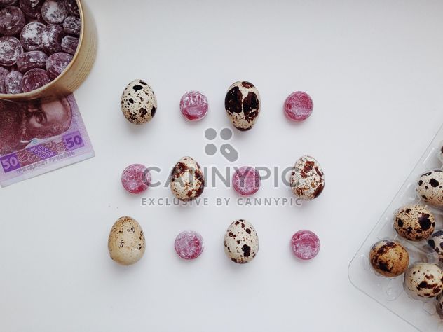 Candies and quail eggs on white background - image gratuit #348665 