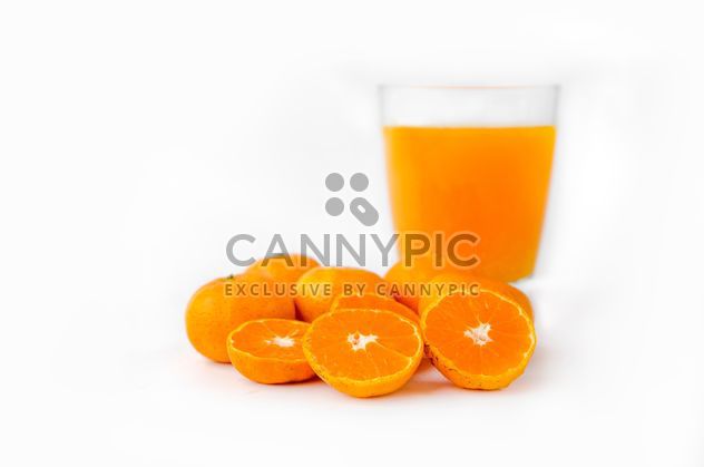 orange juice in glass on white background - бесплатный image #452525